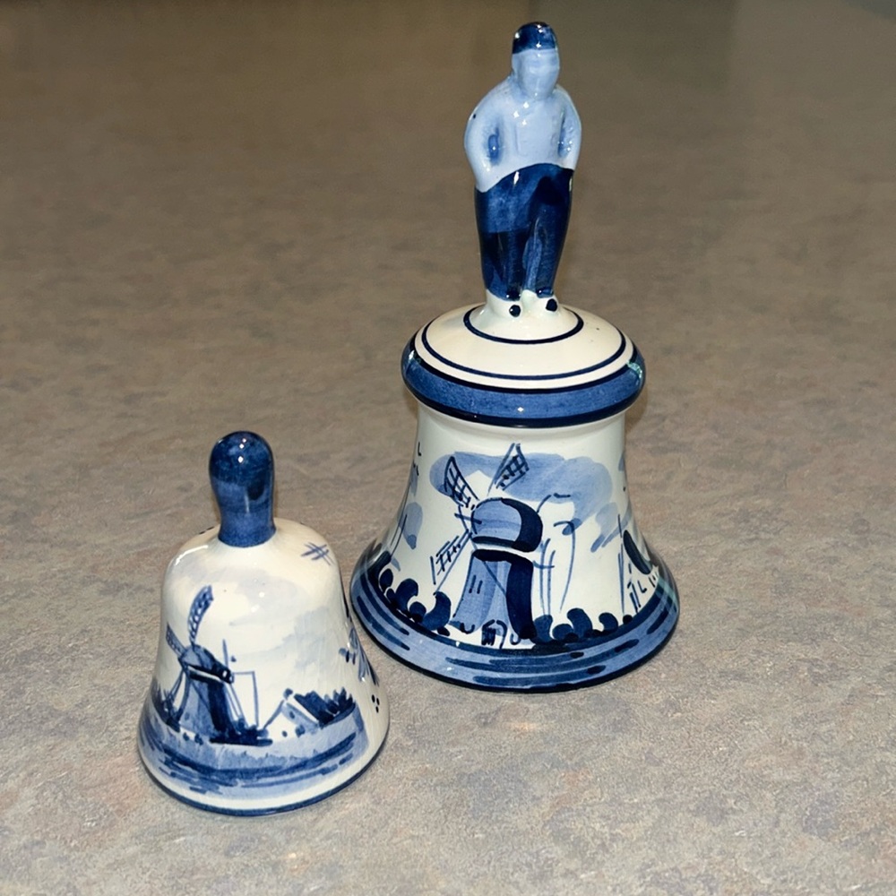 Two delfts blue hand painted bells.$28 for both
